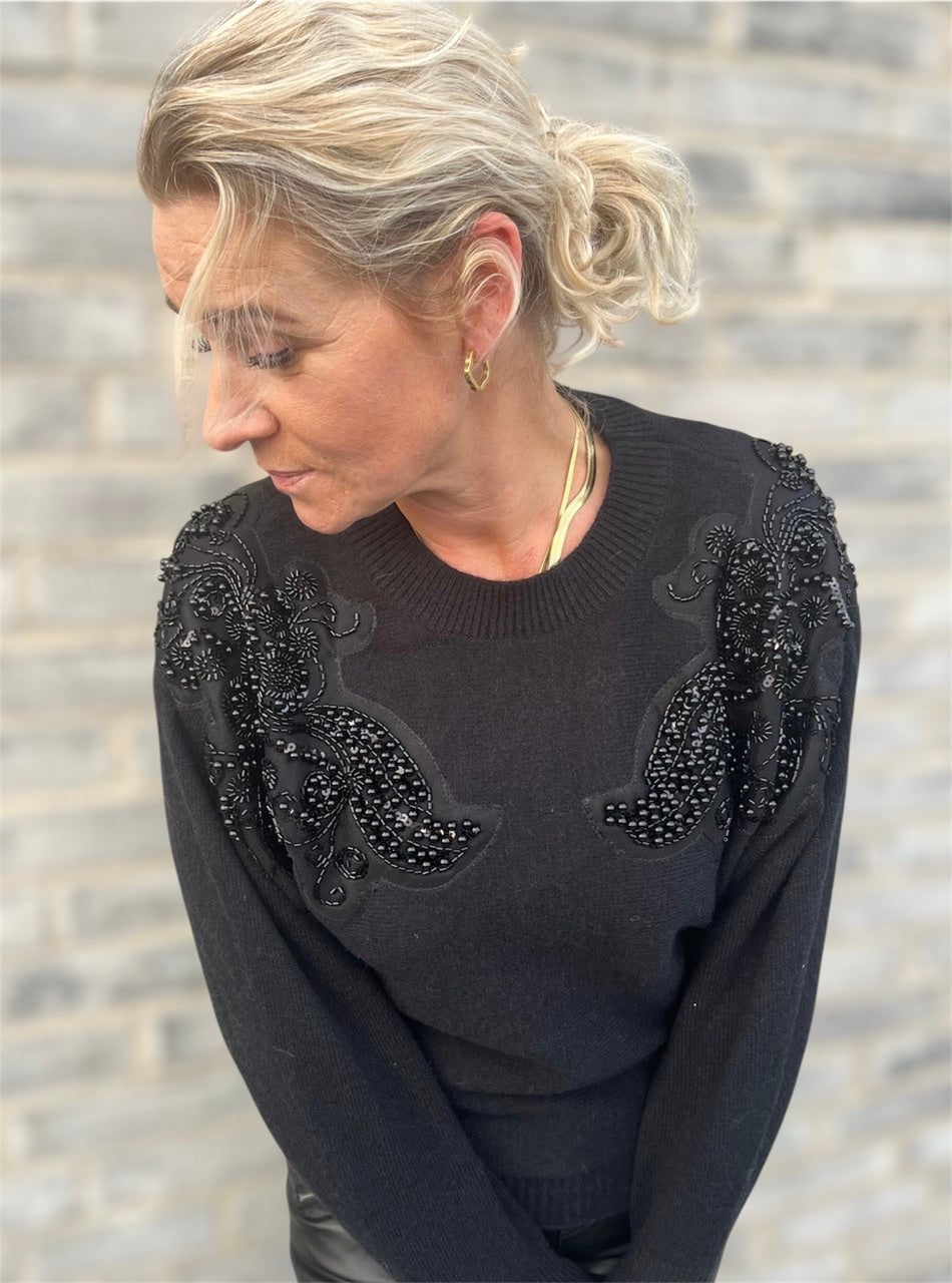 Blød sweater med sequin detaljer